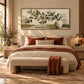 Olive Vessel artwork displayed above a bed with a rust-colored throw.