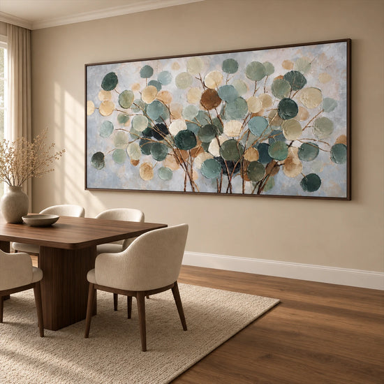 Eucalyptus Drift artwork displayed above a wooden desk and cream chair.
