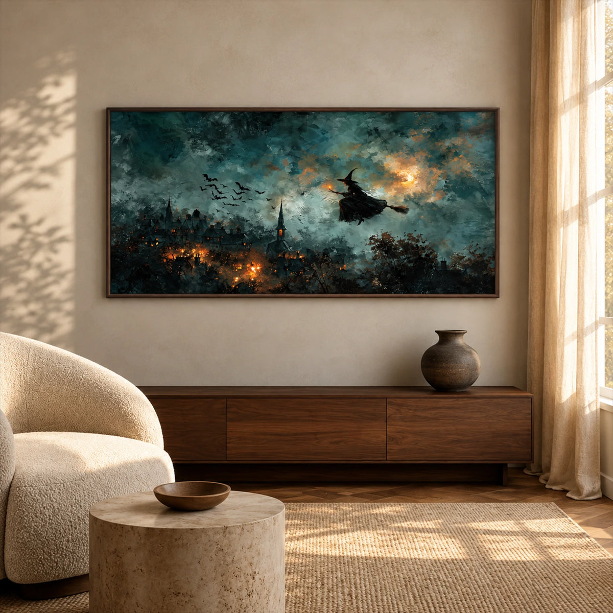 Midnight Broomflight artwork displayed above a wooden sideboard near a cream chair.
