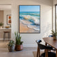 Sunwashed Breakers artwork displayed beside a wooden dining table and plants.