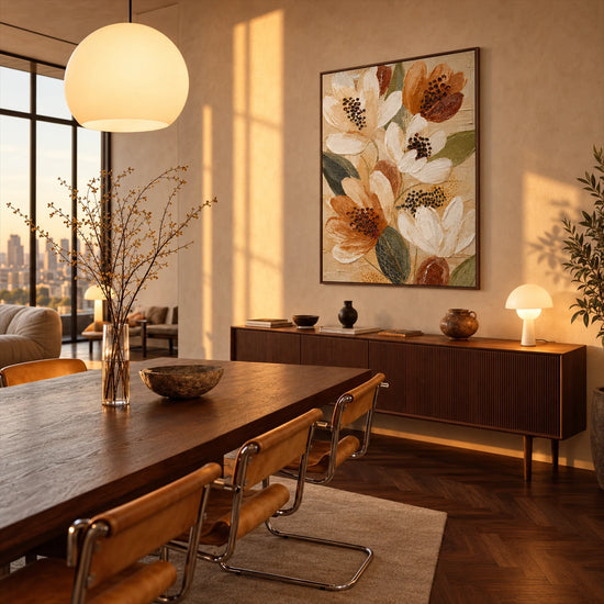 Ochre Petals artwork displayed above a wooden dining table.