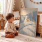 Bedtime Duck artwork displayed leaning beside a child in a nursery.