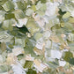 Sage Confetti full artwork. Small strokes of sage, olive, cream, and white overlap across the surface like scattered petals.