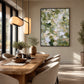 Sage Confetti artwork displayed above a wooden dining table.