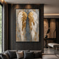 Gilded Wings artwork displayed above a dark sofa beside a window.