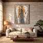Gilded Wings artwork displayed above a cream sofa and low wooden table.
