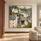 Hillside Gables artwork displayed beside cream seating in a warm living room.