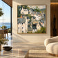 Hillside Gables artwork displayed on a bright wall beside an open doorway.