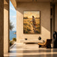 Golden Invitation artwork displayed above a bench overlooking the sea.