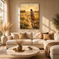 Golden Invitation artwork displayed above a cream sofa beside a tall window.