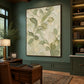 Tender Foliage artwork displayed above a wooden desk against green paneling.
