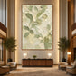 Tender Foliage artwork displayed above a console in a double-height foyer.