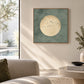 Sage Moonrise artwork displayed above cream seating in a sunlit room.