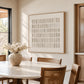 Ivory Register artwork displayed beside a wooden dining table.
