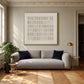 Ivory Register artwork displayed above a gray sofa.
