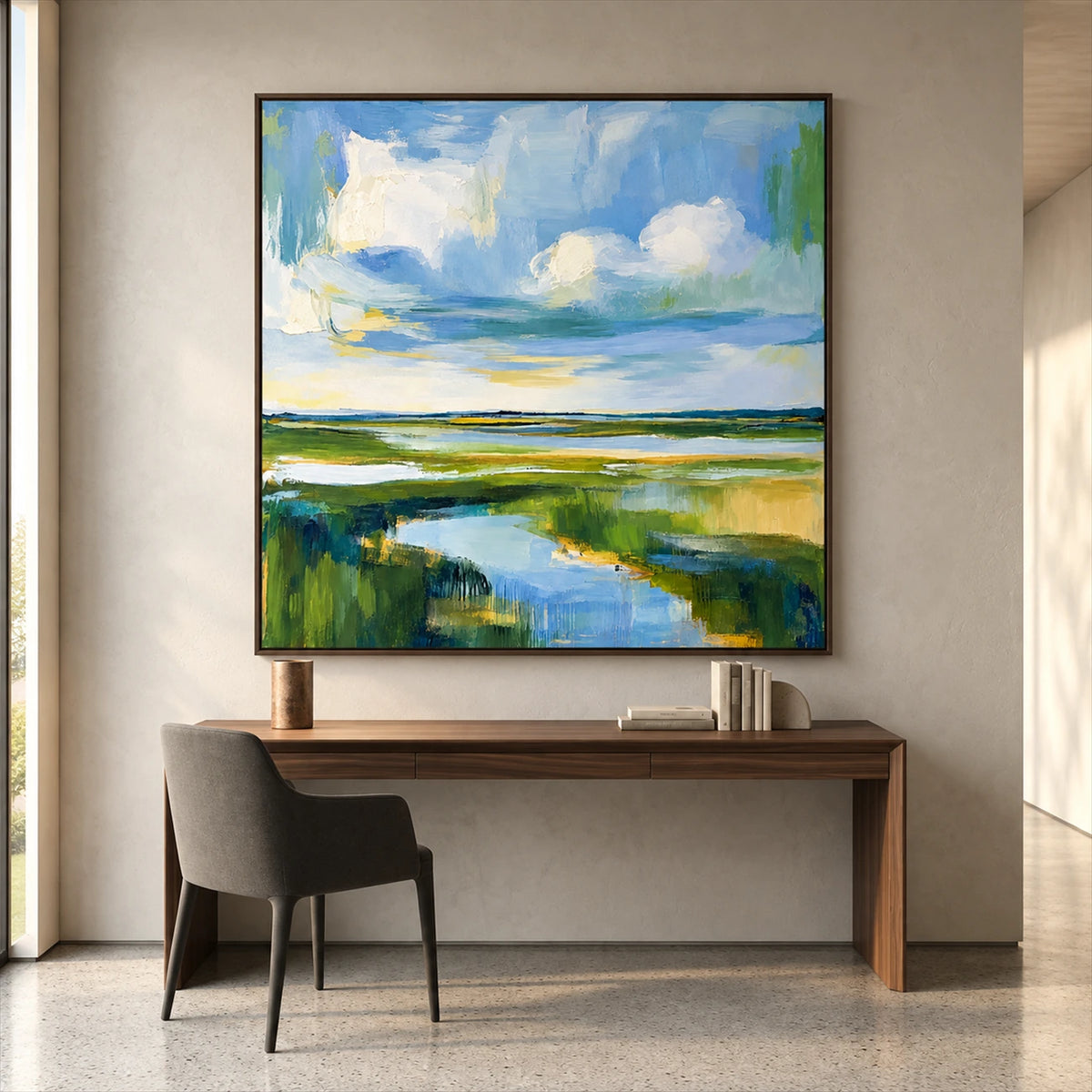 Marshlight Bend artwork displayed above a wooden desk.