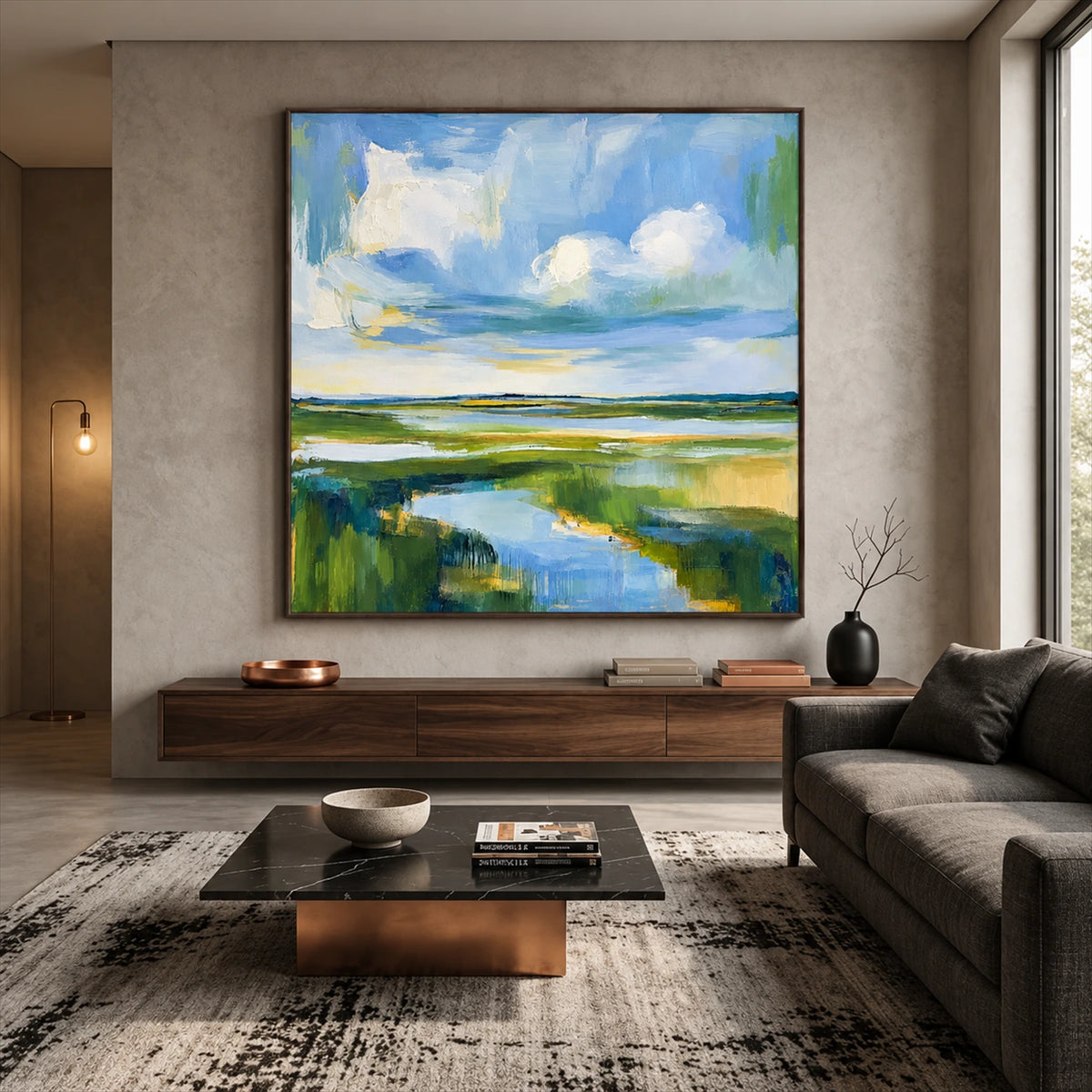 Marshlight Bend artwork displayed above a low cabinet beside gray seating.