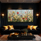Wildflower Chorus artwork displayed above a dark sectional.