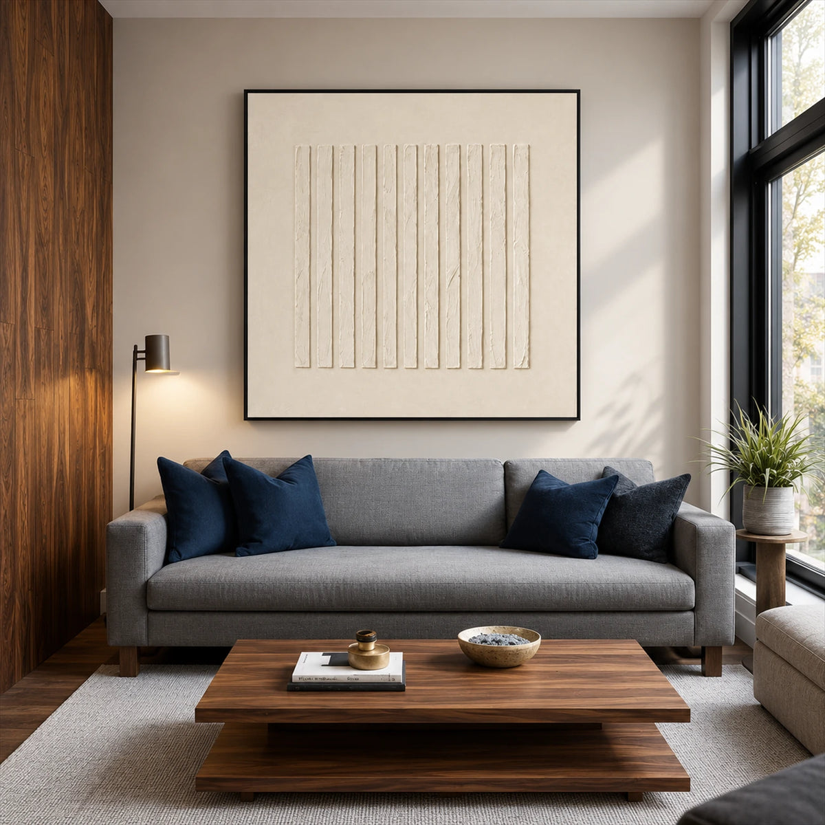 Quiet Fluting artwork displayed above a gray sofa and wooden table.