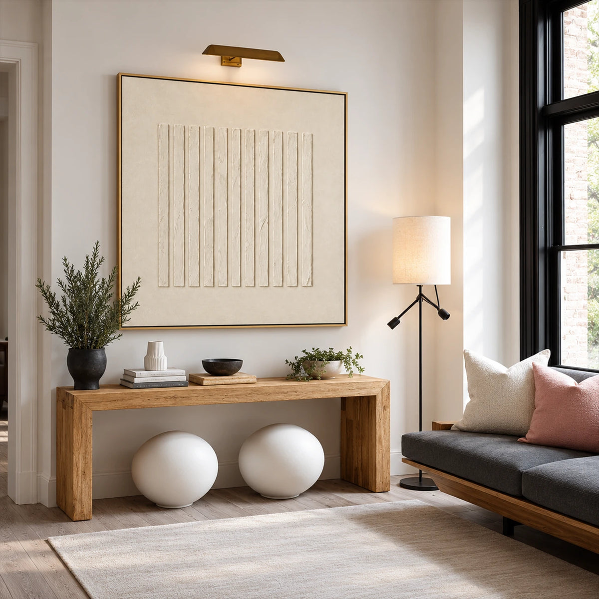 Quiet Fluting artwork displayed above a wooden console and decorative spheres.