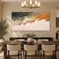 Ochre Mistfall artwork displayed above a dark wooden dining table.
