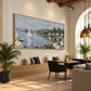 Hydrangea Harbor artwork displayed above a wooden bench beside a dining table.