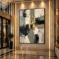 Gilded Junction artwork displayed on a marble wall in a tall foyer.