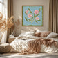 Blush Sprigs artwork displayed above a bed with relaxed linen.