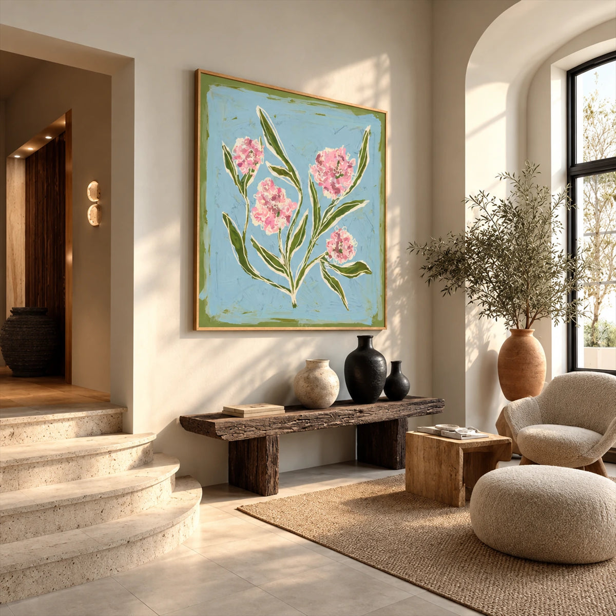 Blush Sprigs artwork displayed above a wooden bench beside an arched window.