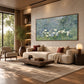Mistgarden Whites artwork displayed above a cream sofa with rust-colored cushions.