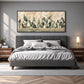Sage Cactus Row artwork displayed above a gray upholstered bed.