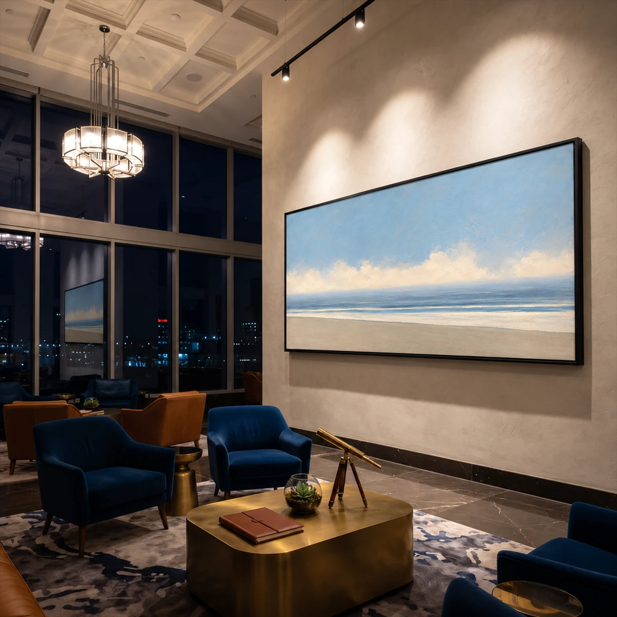 Open Shoreline artwork displayed above lounge chairs in a tall room.