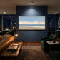 Open Shoreline artwork displayed above seating against a dark blue wall.
