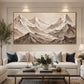 Alpine Relief artwork displayed above a cream sofa with blue cushions.
