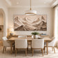 Alpine Relief artwork displayed above a wooden dining table.