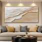 Sandy Tides artwork displayed above a sofa with yellow cushions.