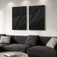 Noir Continuum two-panel artwork set displayed above a dark sectional sofa.