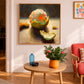 Citrus Peel artwork displayed above a wooden table in a warm pink room.