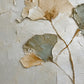 Ginkgo Whispers full artwork. Fan-shaped ginkgo leaves in ivory and muted gray rise on delicate stems against a textured pale ground.