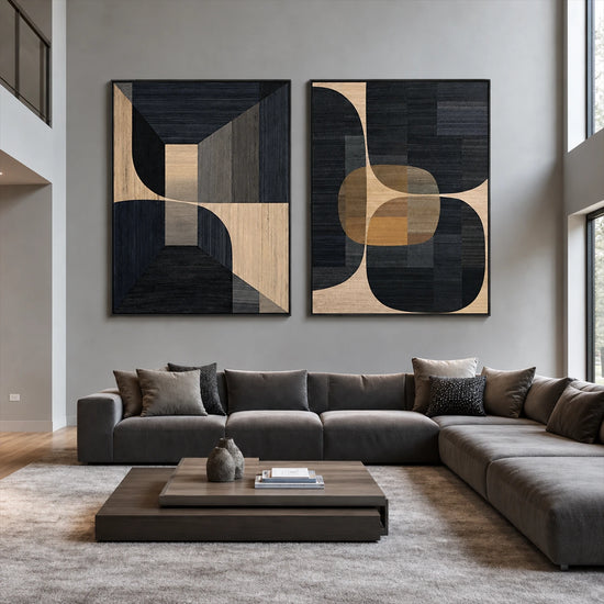 Noir Geometry two-panel artwork set displayed above a dark sectional sofa.