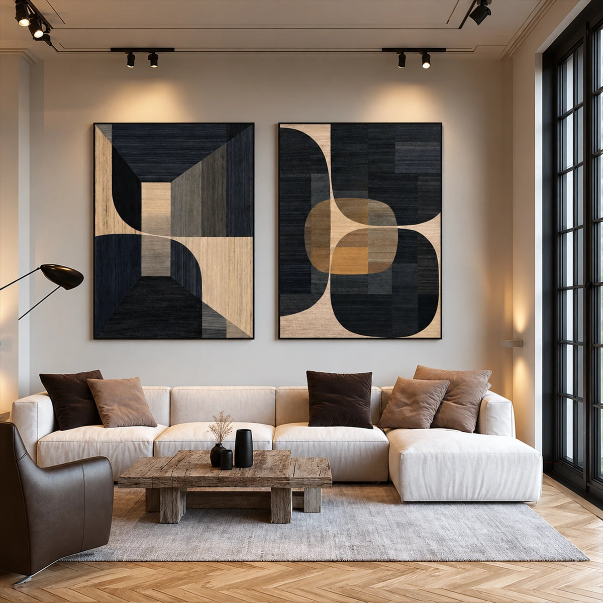 Noir Geometry two-panel artwork set displayed above a cream sofa beside a window.
