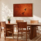 Ember Hover artwork displayed above a wooden dining table and woven chairs.
