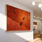 Ember Hover artwork displayed on a bright hallway wall.