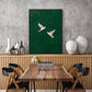 Emerald Flight artwork displayed above a wooden sideboard beside a dining table.