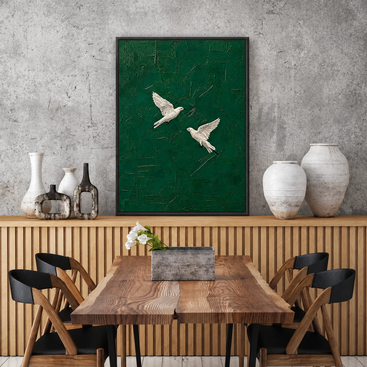 Emerald Flight artwork displayed above a wooden sideboard beside a dining table.