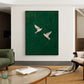 Emerald Flight artwork displayed above a curved coffee table beside green seating.