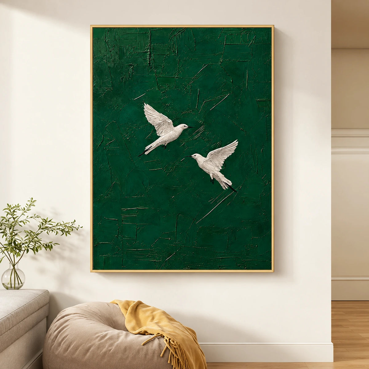 Emerald Flight artwork displayed above a sofa near a sunlit window.