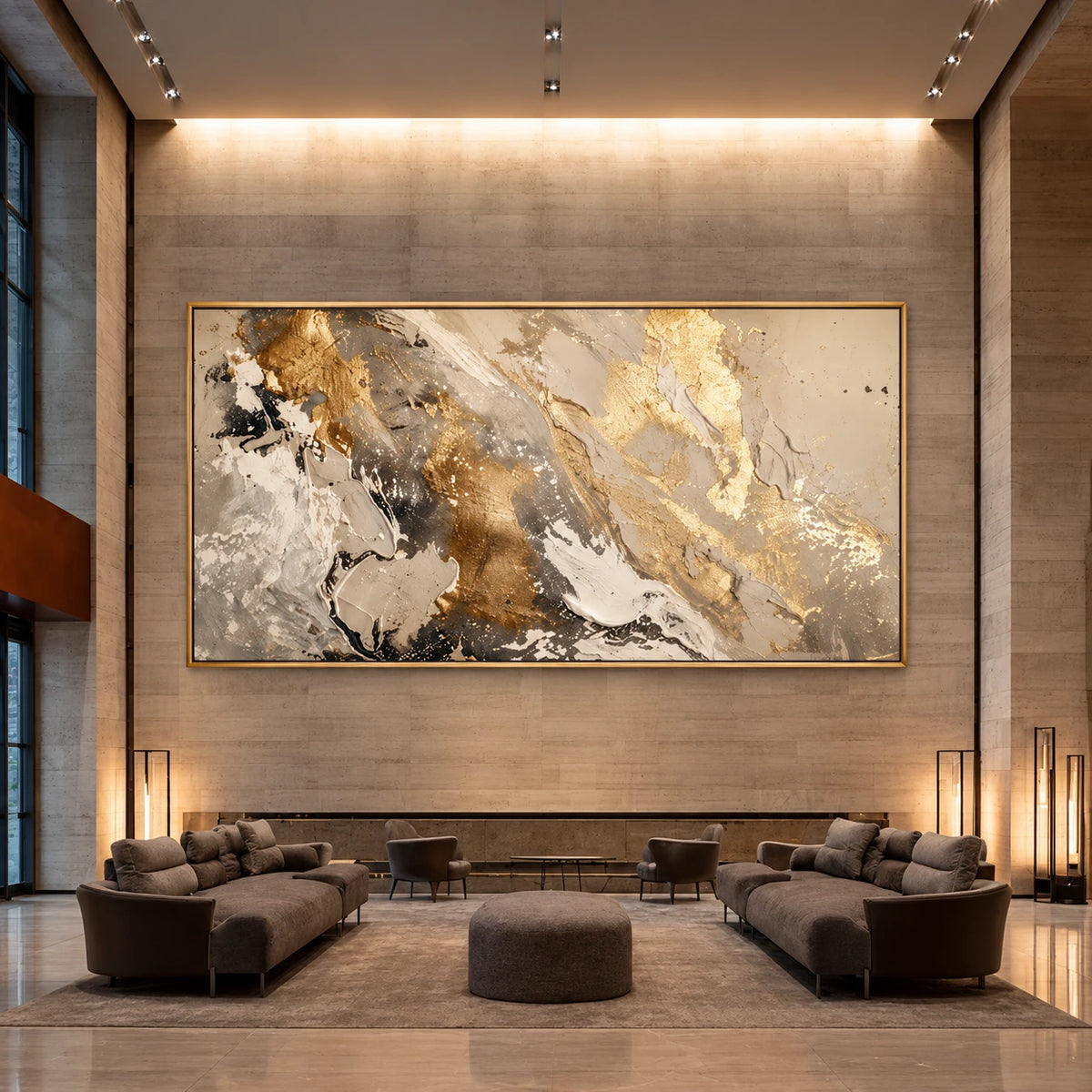 Gilded Confluence artwork displayed above lounge seating beneath a tall illuminated wall.