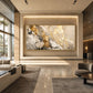 Gilded Confluence artwork displayed on a recessed wall in a bright modern lobby.