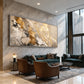 Gilded Confluence artwork displayed above green seating beside tall windows.